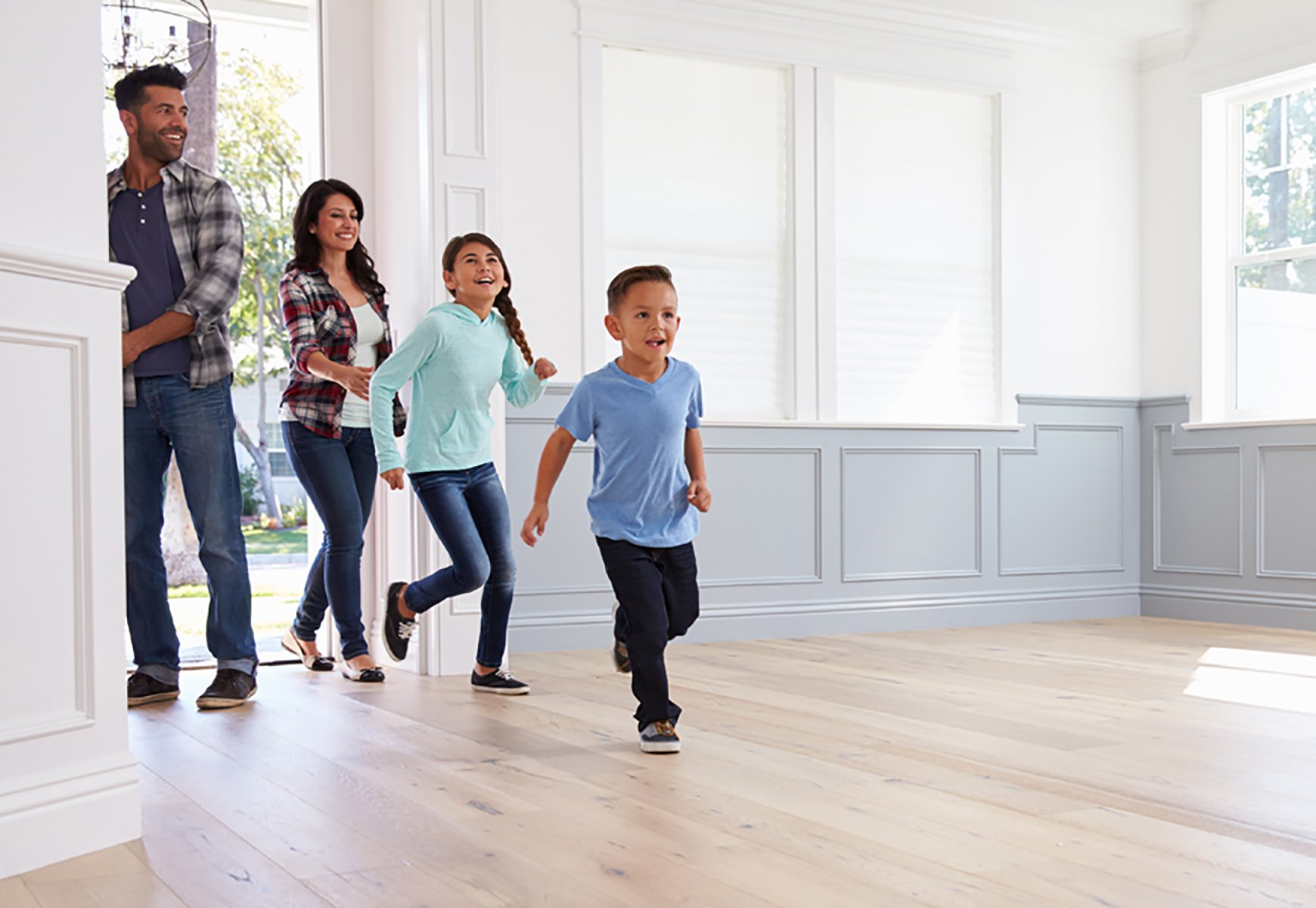 family running into new home